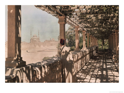 An Egyptian Man Looks Out Over The City From A Trellised Walkway by W. Robert Moore Pricing Limited Edition Print image