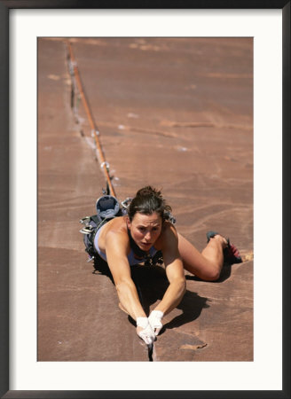 A Young Woman Climbing In Canyonlands National Park, Utah by Jimmy Chin Pricing Limited Edition Print image