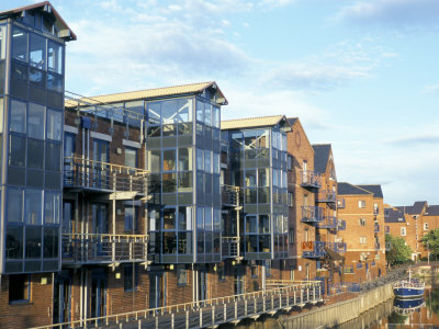 Flats In Restored Wharf Buildings On The River Aire, Leeds, West Yorkshire, England by Brigitte Bott Pricing Limited Edition Print image