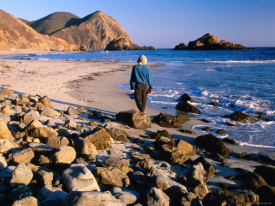 Person Walking On Pfeiffer Beach, Big Sur, California by Eddie Brady Pricing Limited Edition Print image