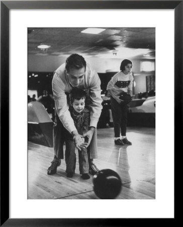 Dad Showing 3 Year Old Daughter The Basics Of Bowling by George Silk Pricing Limited Edition Print image