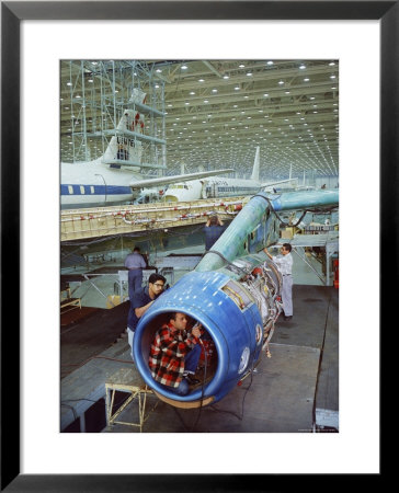 Workers Building The Engine Of A Dc-8 Passenger Jet At The Douglas Aircraft Plant by Ralph Crane Pricing Limited Edition Print image
