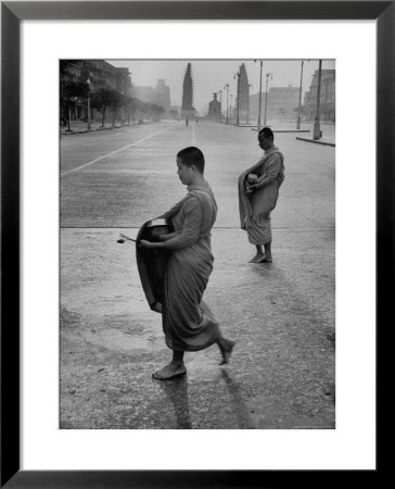 Monks Begging For Food At Dawn On Main Thoroughfare Of Bangkok by Howard Sochurek Pricing Limited Edition Print image