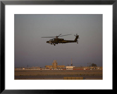 Ah-64 Apache Helicopter Flies By The Control Tower On Camp Speicher by Stocktrek Images Pricing Limited Edition Print image