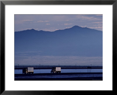 Trucks Along The Highway Next To Great Salt Lake, Utah by Kenneth Garrett Pricing Limited Edition Print image