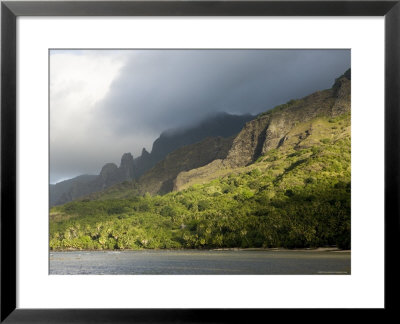 Storm Clouds Rolling In Over Sunlit Anaho Bay, French Polynesia by Tim Laman Pricing Limited Edition Print image