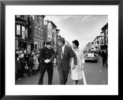 Sen. Jack Kennedy With Jackie, Walking Down Middle Of The Street During Senate Re-Election Campaign by Carl Mydans Pricing Limited Edition Print image