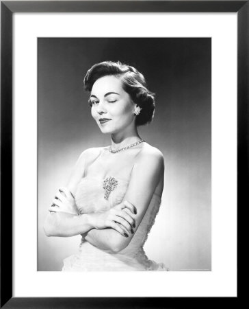 Woman In Evening Wear Winking Her Eye by Ewing Galloway Pricing Limited Edition Print image