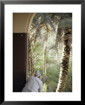 Man Reading Koran In Mosque, Malindi, Kenya, East Africa, Africa by Upperhall Ltd Pricing Limited Edition Print image