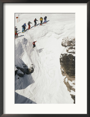 Skilled Skiers Plunge More Than 15 Feet In Corbet's Couloir At Jackson Hole, Wyoming by Raymond Gehman Pricing Limited Edition Print image