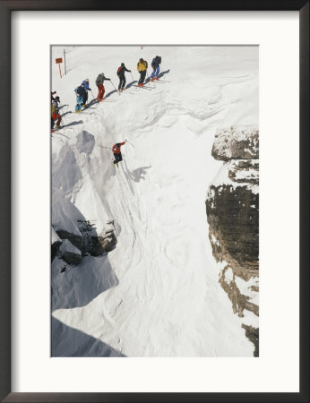 Skilled Skiers Plunge More Than 15 Feet In Corbet's Couloir At Jackson Hole, Wyoming by Raymond Gehman Pricing Limited Edition Print image