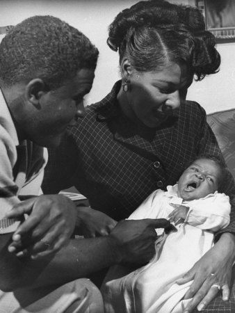 Baseball Great Jackie Robinson With Wife Rae And Infant Daughter Sharon, In Mother-In-Law's Home by J. R. Eyerman Pricing Limited Edition Print image