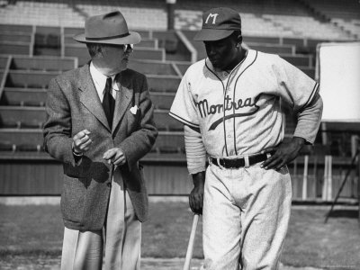 Baseball Great Jackie Robinson Listening To Director Al Green by J. R. Eyerman Pricing Limited Edition Print image