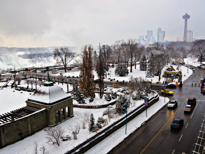 Snow Covers Niagara Fall Town In Winter by John Pennock Pricing Limited Edition Print image