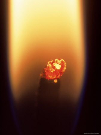 Close-Up Of Flame Around Candle Wick by David Ennis Pricing Limited Edition Print image
