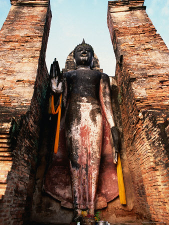 Offerings At Feet Of Buddha Statue, Sukhothai Historical Park, Thailand by Chris Mellor Pricing Limited Edition Print image