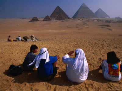 Tourists And Guides Sitting In Front Pyramids, Giza, Egypt by Mason Florence Pricing Limited Edition Print image