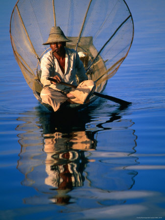 Man In Traditional Boat On Lake, Inle Lake, Myanmar (Burma) by Juliet Coombe Pricing Limited Edition Print image