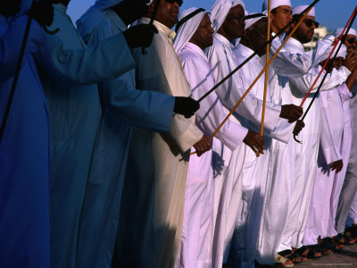 Men Performing Dance, With Sticks, Abu Dhabi, United Arab Emirates by Chris Mellor Pricing Limited Edition Print image