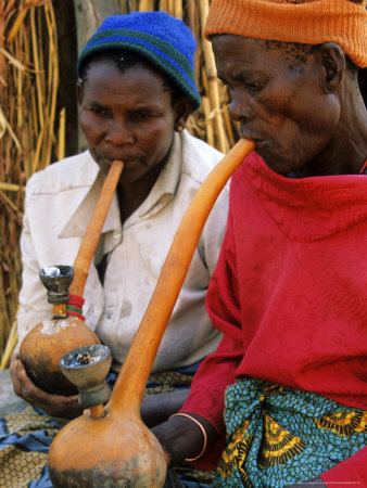 Tonga Women From Batonka Tribe Smoking Pipes, Zimbabwe by Roger De La Harpe Pricing Limited Edition Print image