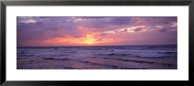 Cayman Islands, Grand Cayman, 7 Mile Beach, Caribbean Sea, Sunset Over Waves by Panoramic Images Pricing Limited Edition Print image