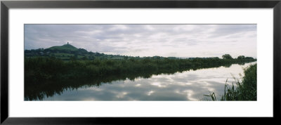 Reflection Of Clouds In The River, River Brue, Glastonbury Tor, Glastonbury, Somerset, England by Panoramic Images Pricing Limited Edition Print image