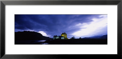 Low Angle View Of A Castle Lit Up At Dusk, Eilean Donan Castle, Highlands, Scotland, United Kingdom by Panoramic Images Pricing Limited Edition Print image