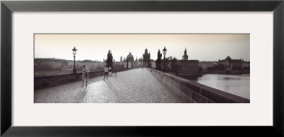 Tourist Walking On A Bridge, Charles Bridge, Prague, Czech Republic by Panoramic Images Pricing Limited Edition Print image