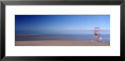 Blurred Motion, Side Profile Of A Woman Running On The Beach by Panoramic Images Pricing Limited Edition Print image