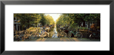 Bicycles On Bridge Over Canal, Amsterdam, Netherlands by Panoramic Images Pricing Limited Edition Print image