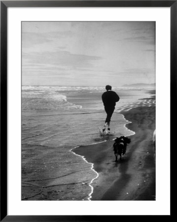 Robert F. Kennedy Running On The Beach With His Dog Freckles by Bill Eppridge Pricing Limited Edition Print image