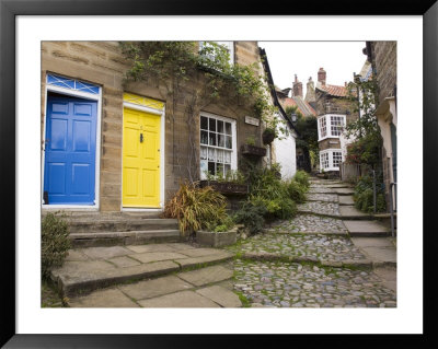 Yellow And Blue Doors On Houses In The Opening, Robin Hood's Bay, England by Pearl Bucknall Pricing Limited Edition Print image