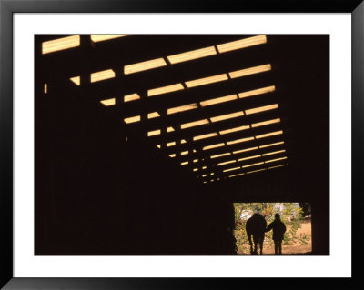 Silhouette Of A Woman With Her Horse Walking Out Of Barn by Kate Thompson Pricing Limited Edition Print image