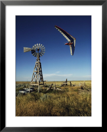 A Hang Glider Swoops Low Over An Old Windmill by Skip Brown Pricing Limited Edition Print image