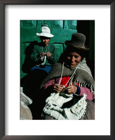 Women In Hats, Knitting Outside In The Sunshine, By A Green Wooden Door, Peru by Richard I'anson Pricing Limited Edition Print image