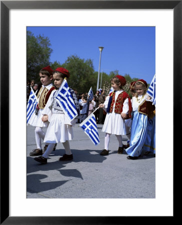 Children In National Dress Carrying Flags, Independence Day Celebrations, Greece by Tony Gervis Pricing Limited Edition Print image