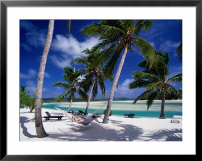 Person Relaxing In Hammock Under Palm Trees On White Sand Beach, Cook Islands by Manfred Gottschalk Pricing Limited Edition Print image