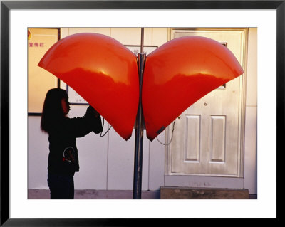 Girl In Telephone Booth In Dongcheng Bejing, China by Phil Weymouth Pricing Limited Edition Print image