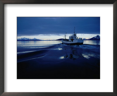 Fishing Boat Plowing Through Calm Waters Outside Of Lofoten, Lofoten, Nordland, Norway by Christian Aslund Pricing Limited Edition Print image