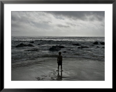 Child Standing At The Edge Of Tide by Krzysztof Rost Pricing Limited Edition Print image