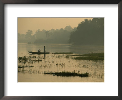 Fishermen Drift Along The Bank Of The Nile As Twilight Falls by Kenneth Garrett Pricing Limited Edition Print image