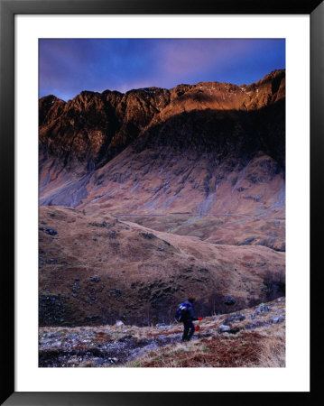 Hiker Descending To Glencoe, Scotland by Gareth Mccormack Pricing Limited Edition Print image