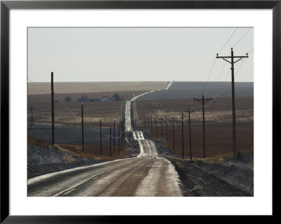 Telephone Poles Line A Dirt Road That Extends To The Horizon by Robert Madden Pricing Limited Edition Print image