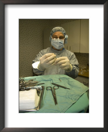 A Surgeon Readies A Scalpel In An Operating Room Prior To Surgery, Washington, D.C. Usa by Taylor S. Kennedy Pricing Limited Edition Print image