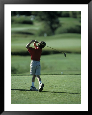 Young Boy Playing Golf, Breckenridge, Co by Bob Winsett Pricing Limited Edition Print image