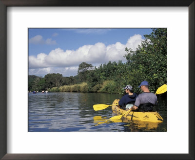 Couple Kayaking The Hule'ia River, Kauai, Hawaii, Usa by John & Lisa Merrill Pricing Limited Edition Print image