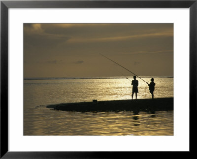 Two Fishermen Silhouetted Against The Pacific Ocean Fishing At Sunset by Todd Gipstein Pricing Limited Edition Print image