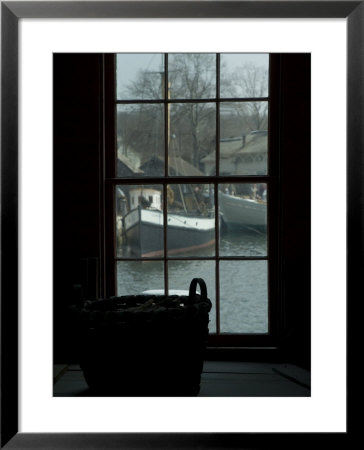 Looking Out Through A Window At Wooden Fishing Boats On A River by Todd Gipstein Pricing Limited Edition Print image