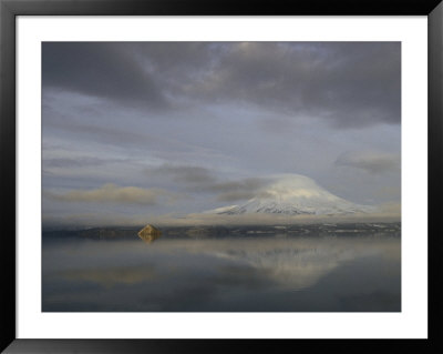 Volcanic Mountain And Clouds With Reflections In Calm Water by Klaus Nigge Pricing Limited Edition Print image