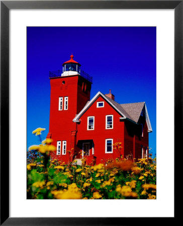Bright Red Two Harbors Lighthouse With Flowers In Foreground, Lake Superior, Two Harbours, Usa by Richard Cummins Pricing Limited Edition Print image